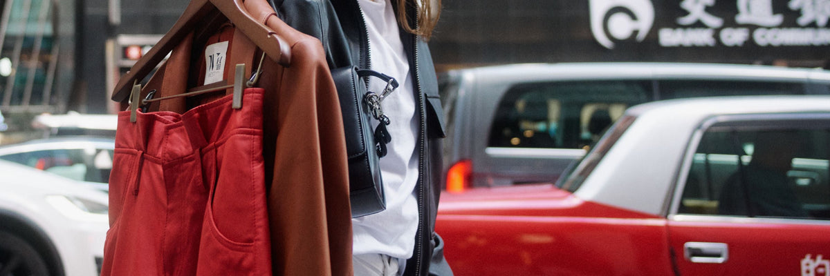 Women's leather shorts by WEST 14TH: red leather shorts on a hanger on a city street